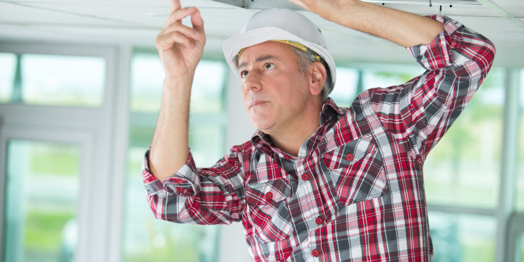 Man Install Suspended Ceiling In House Man Install Suspended Ceiling In House